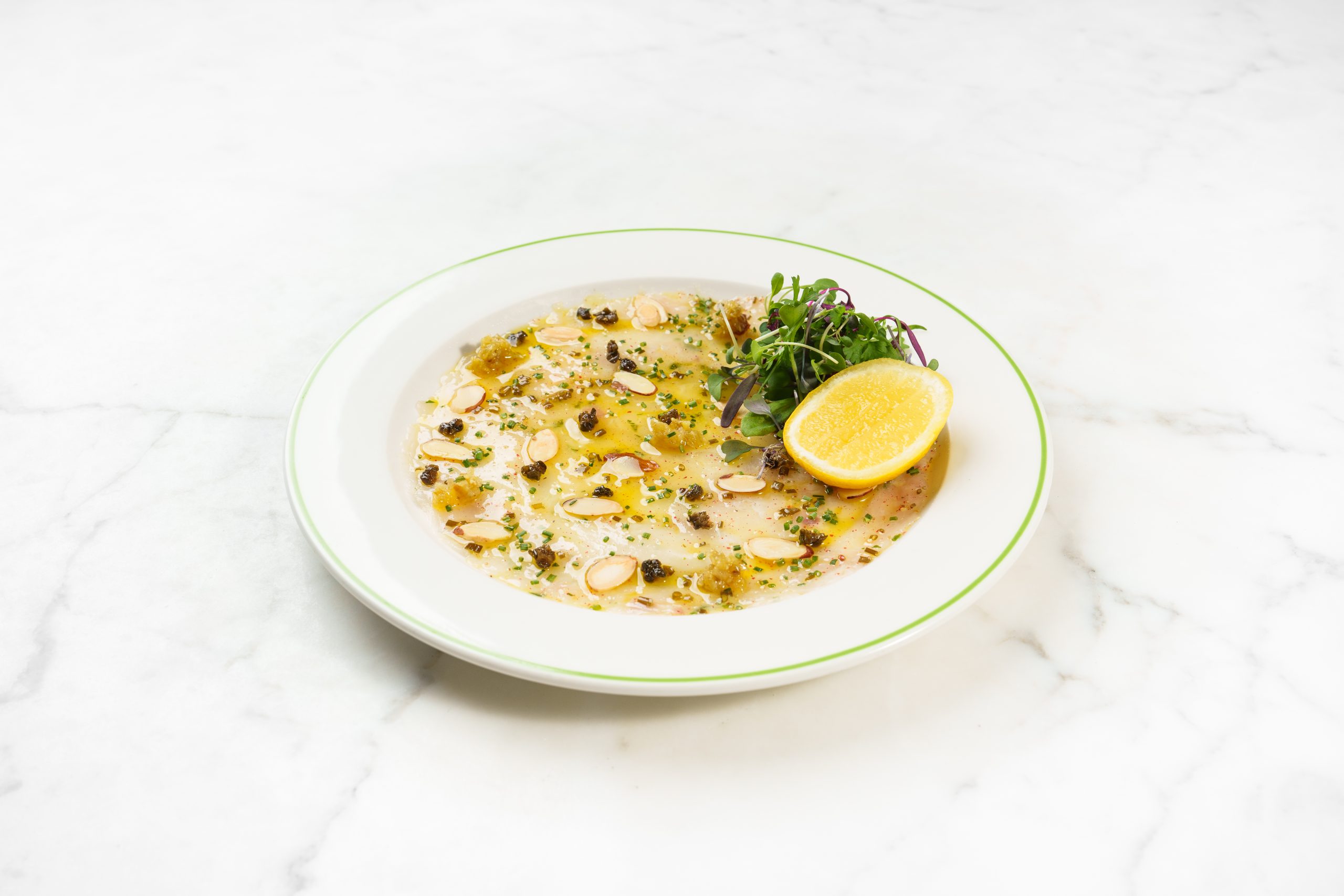 Sea Bass Carpaccio with Capers, Almonds & Raisins