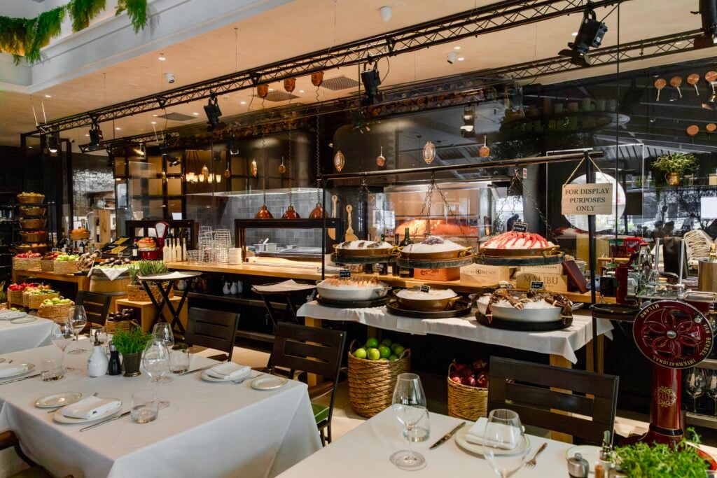 Open kitchen counter with seafood and antipasti on display