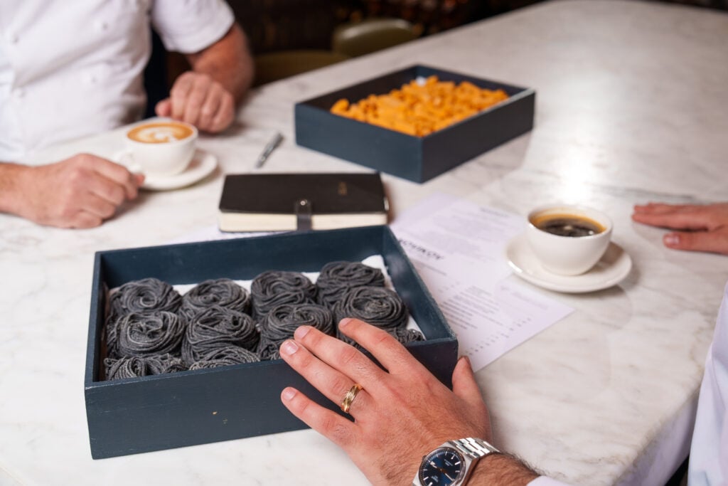 Handmade pasta nests in a box at the pasta station