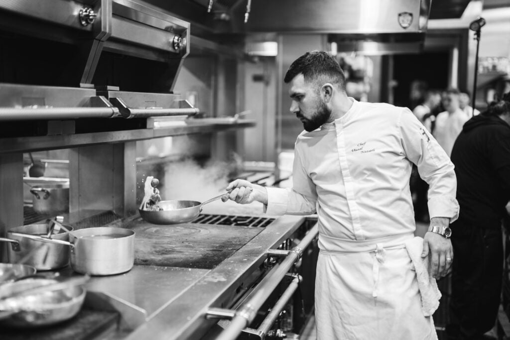 Chef cooking at the stove in the kitchen