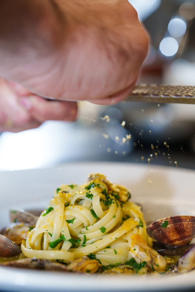 Linguine with clams finished with grated bottarga
